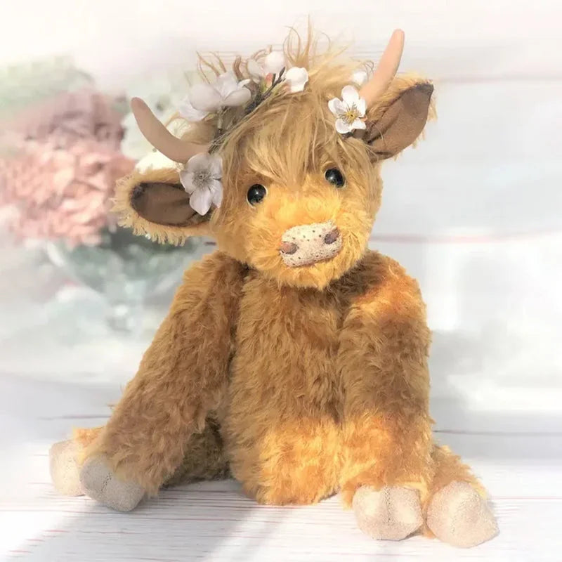 Highland ko-ornament med blomsterhovedbeklædning